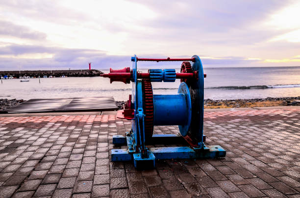 Old Vintage Metal Winch in a Port Harbor