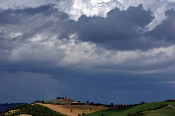 storm clouds in the sky on the profile of a hill