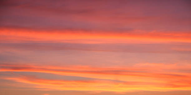 istock Beautiful colorful orange clouds at sunset. Bright sunset sky, full frame. The sky as a background. Low Angle View Of Dramatic Sky 2099584328