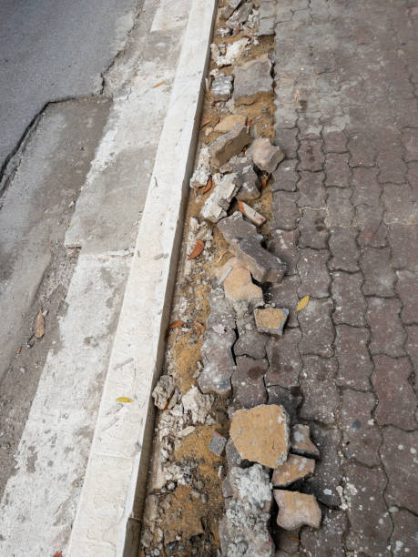 istock The footpath way is broken from the erosion. 2099593426