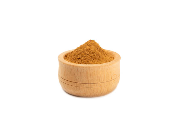 istock Cinnamon powder  isolated on white background. Spicy spice for baking, desserts and drinks. Fragrant ground cinnamon. 2099603095