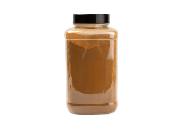 istock Cinnamon powder  isolated on white background. Spicy spice for baking, desserts and drinks. Fragrant ground cinnamon. 2099603486