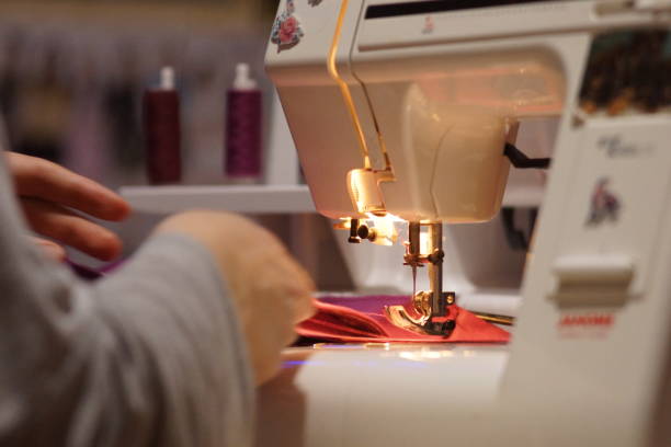Sewing machine with a red cloth on the table in a tailor shop