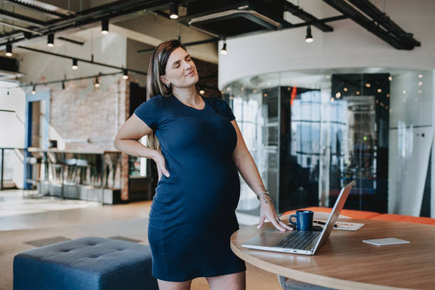 istock Pregnant woman with back pain 2099664856