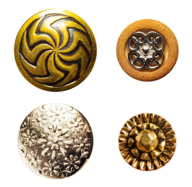 A pile of buttons of various shapes and sizes. The buttons are scattered across the image, with some overlapping each other. Concept of abundance and variety
