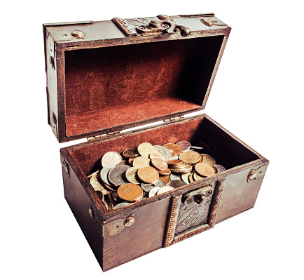 Treasure chest filled with chocolate coins of the queen Elizabeth.