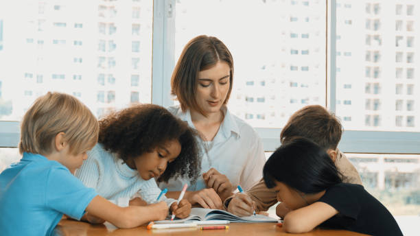istock Professional caucasian teacher telling story to diverse student. Erudition. 2099693301