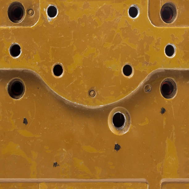 Seamless texture photo of rusty and worn armored desert vehicle surface with holes.