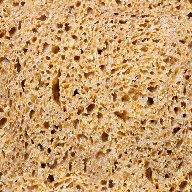 istock Seamless photo texture of brown bread. 2099697784