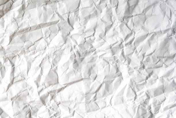 istock Heavily wrinkled paper close-up 2099699414