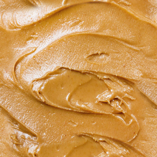 istock Seamless photo texture of peanut butter paste. 2099702559