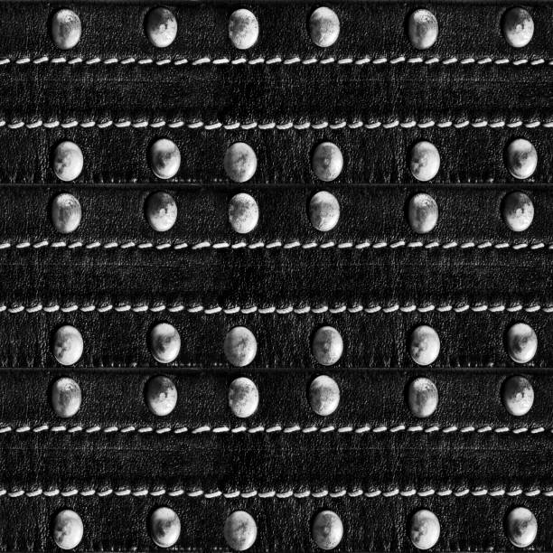 istock Seamless texture of leather belt with rivets. 2099707386
