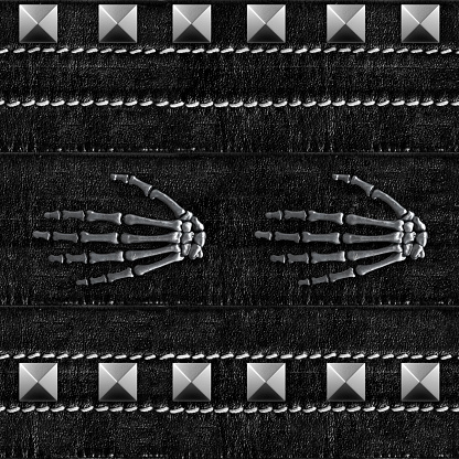 Seamless texture photo of black denim stitched belt with metal skeleton hands and rivets engraving.