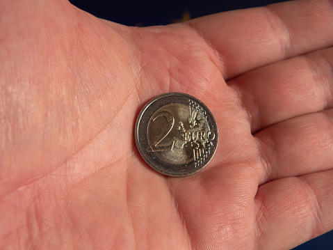 Close-up of a 2 Euro Coin in Hand