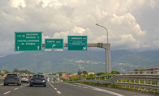 Cars on an Italian freeway driving out of Naples in the direction of Pompeii, Sorrento and the Amalfi coast.