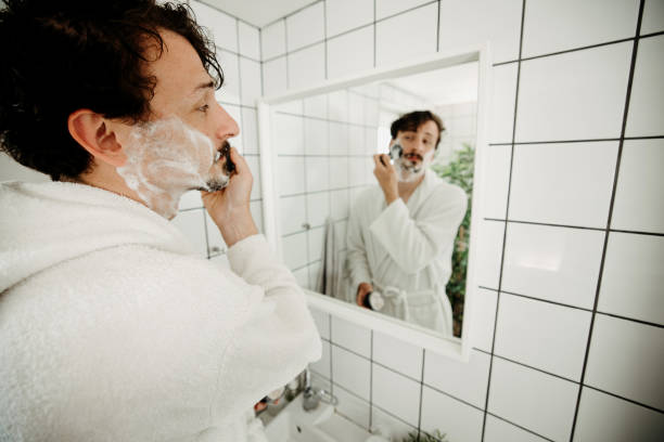 istock Man shaves in the bathroom 2099732166