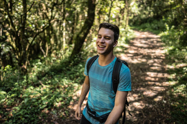 istock Young man walking during hiking on forest 2099742243