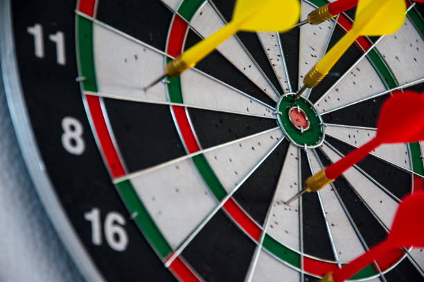 istock Dartboard and some colorful darts 2099746071