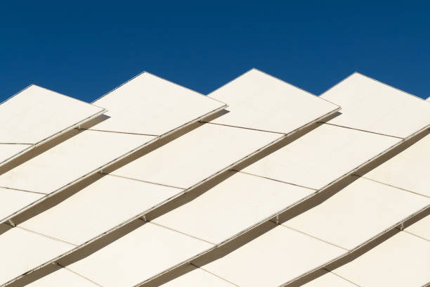Beautiful white modern building against a blue sky. Art and architecture. Perfectionism.