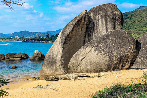 Huge rocks on the shore of the South China Sea in the World's End park. Sanya, China.