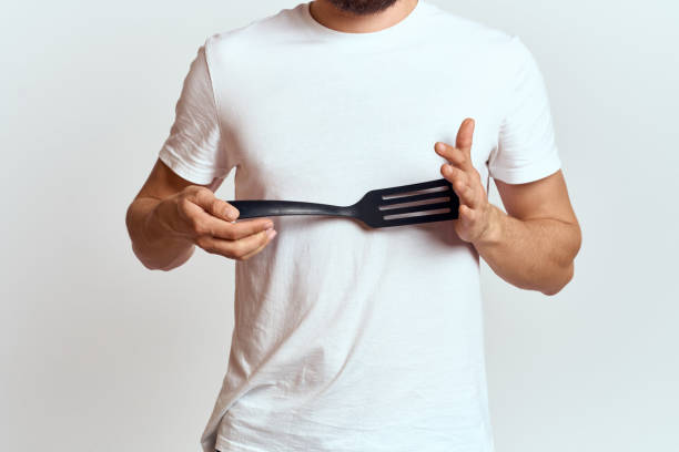 istock man with shovel for cooking white t-shirt cropped view light background 2099766493