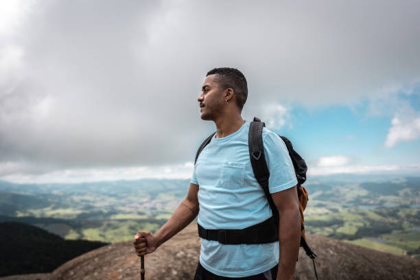 istock Young man looking at view on a mountain 2099771956