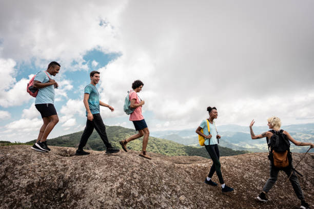 istock Young friends doing a trail on a mountain 2099772505