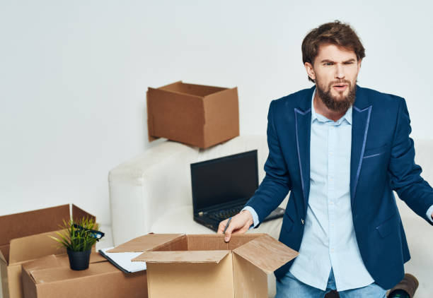 istock Business man in office suit boxes with things moving laptop technology official packing 2099782618