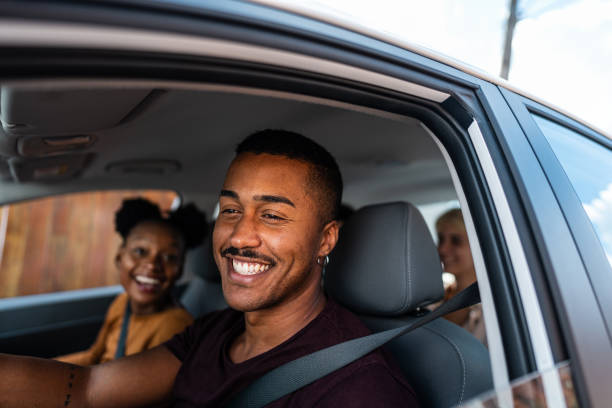 istock Young man driving a car during a friends trip 2099802226