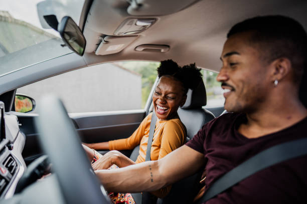 istock Young woman talking with friend on a car 2099802232
