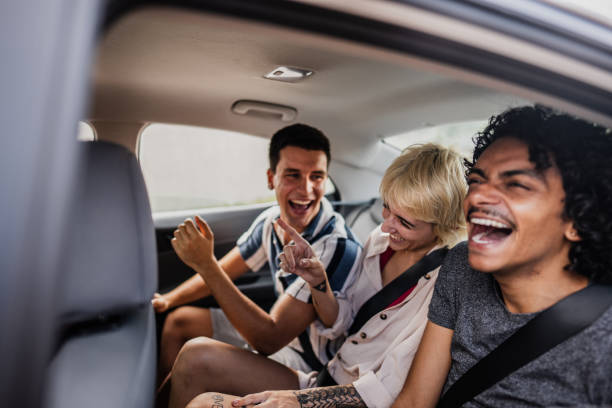 istock Friends dancing inside a car during a road trip 2099802245