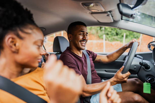 istock Friends dancing inside a car during a road trip 2099802759