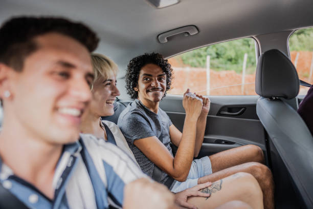 istock Friends dancing inside a car during a road trip 2099802763