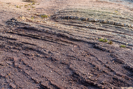 Full frame of colorful sandstone hill in Wahiba desert in Oman.