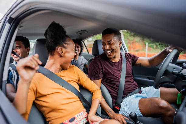 Friends talking on a car during a trip