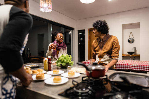 istock Friends talking on hamburger night at home 2099851961