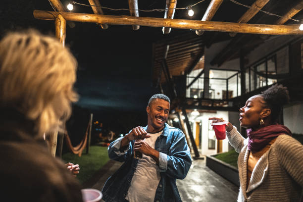istock Friends a having fun on a night party at house yard 2099855174
