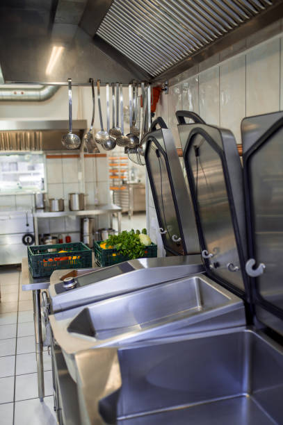 istock Industrial dishwasher in restaurant kitchen washing dishes 2099860082