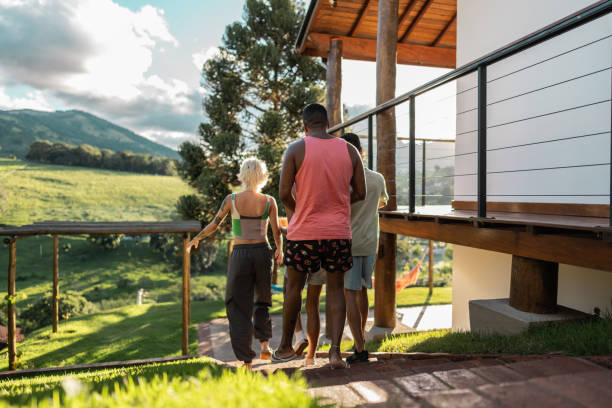istock Friends walking on house yard 2099865533