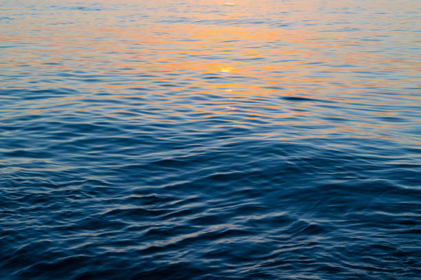 istock Sun glare on the water. Sunset over the sea. 2099884012