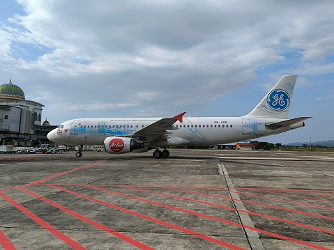 Blang Bintang, Aceh Besar, Aceh, Indonesia, Aceh Besar, Aceh, Indonesia, February 26, 2024 - The World Best Low Cost Airline, Air Asia just landed from Kuala Lumpur to Banda Aceh, the aircraft just full stop and disembark the passengers shortly