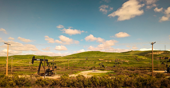 I wonder how many oil wells fill the rural landscapes of America. Something oddly beautiful about the juxtaposition of a scenic landscape, riddled with pollutants and powerlines.