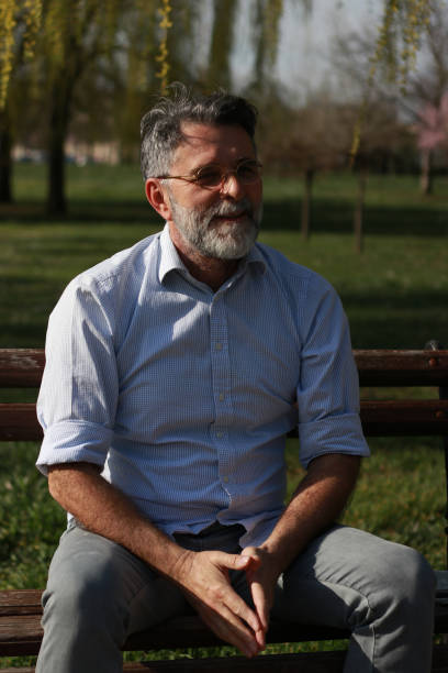 istock Emotions of mature man in public park 2099895565