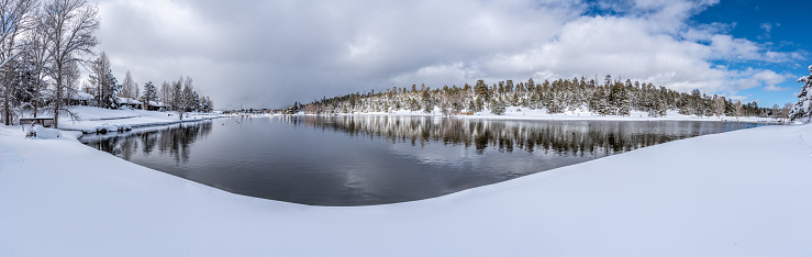 People don't normally think of Arizona as a place that gets much snow in the winter.  This scene of snow around the lake was photographed in Northern Arizona at the town of Flagstaff.  At 7000 feet elevation, snow falls often here in the winter, sometimes accumulating one to two feet at a time.