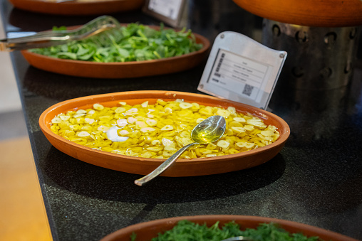 Fresh garlic and olive oil sauce ready to serve on the counter