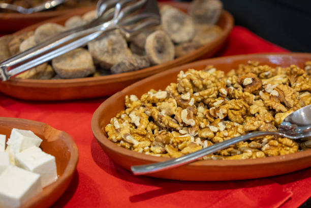 Plates of walnuts and figs at the breakfast buffet
