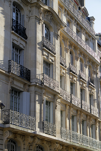 Paris, charming street and buildings, typical parisian facades in the Marais