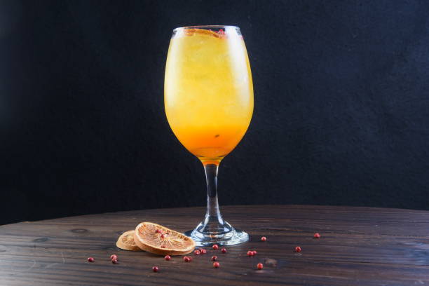 istock refreshing alcoholic drink with berries, ice vodka and gin, lemon peel served in glass cup on the counter on blurred background 2099953017