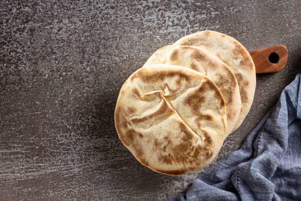 istock Pita bread on the table. Arabic lebnani bread. 2099953543