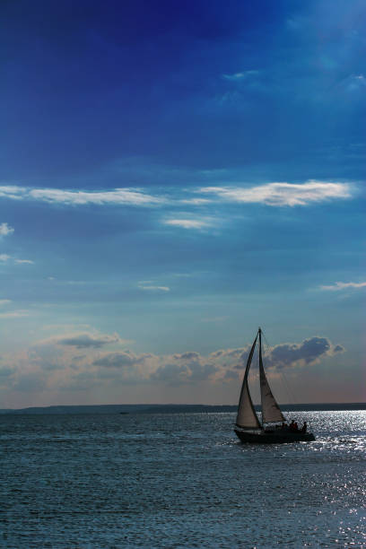 A sailing boat in the open and calm Mediterranean Sea.